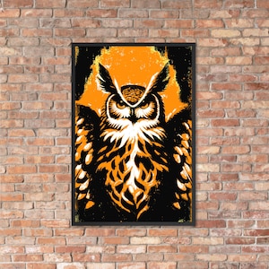May include: Framed art print of a stylized owl illustration. The owl is rendered in orange, black, and white, set against an orange backdrop. The artwork has a bold, graphic style, suitable for wall decor.