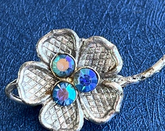 metal and rhinestone flower brooch