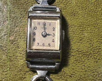 Jolie montre vintage oris pour femme qui fonctionne.