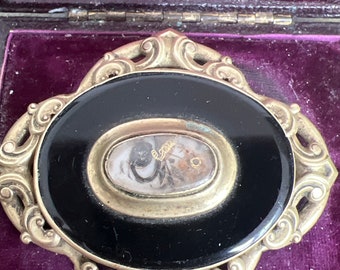 Victorian mourning brooch with pinchbeck metal and hair arrangement