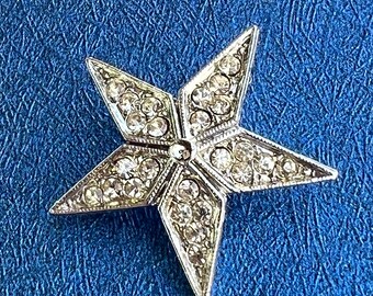 Pretty metal and glass star brooch