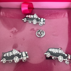 boxed butler and Wilson metal and glass car cuff links and tie pin
