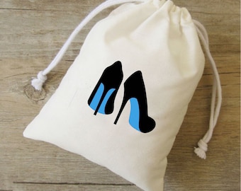 May include: A white cotton drawstring bag with a black and blue high heel shoe design.