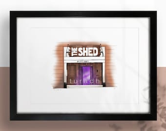 May include: A black and white illustration of a building with a sign that says "The Shed" and the text "#Lets Dance". The building has a purple door and a brown door frame.