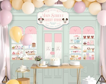May include: A pastel green and pink backdrop with a storefront sign that reads "Main Street Sweet Store". The store has shelves filled with colorful treats and a Mickey Mouse character on each side of the sign.