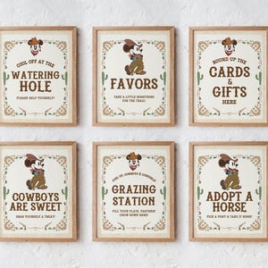 May include: Six printable signs featuring a cartoon mouse wearing a cowboy hat and vest. The signs have a rustic western theme and include text such as "Cool Off at the Watering Hole", "Favors", "Round Up the Cards & Gifts Here", "Cowboys Are Sweet", "Grazing Station", and "Adopt a Horse".