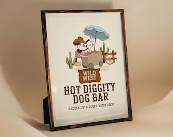 May include: A framed illustration of Mickey Mouse dressed as a cowboy, selling hot dogs from a cart. The sign reads "Wild West Hot Diggity Dog Bar Saddle Up & Build Your Own!"