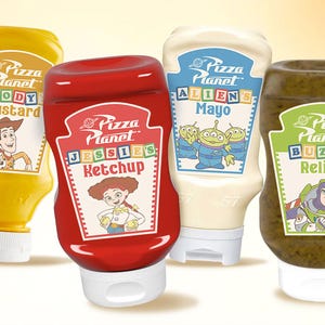 May include: Four condiment bottles with the "Pizza Planet" logo and character illustrations. The bottles contain mustard, ketchup, mayo, and relish. The mustard bottle features Woody, the ketchup bottle features Jessie, the mayo bottle features the Aliens, and the relish bottle features Buzz.