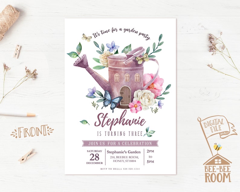May include: A purple watering can with a house-shaped design, surrounded by flowers and butterflies. The text "Stephanie is turning three" is written below the watering can. The invitation is for a garden party on Saturday, December 28th from 2pm to 5pm.
