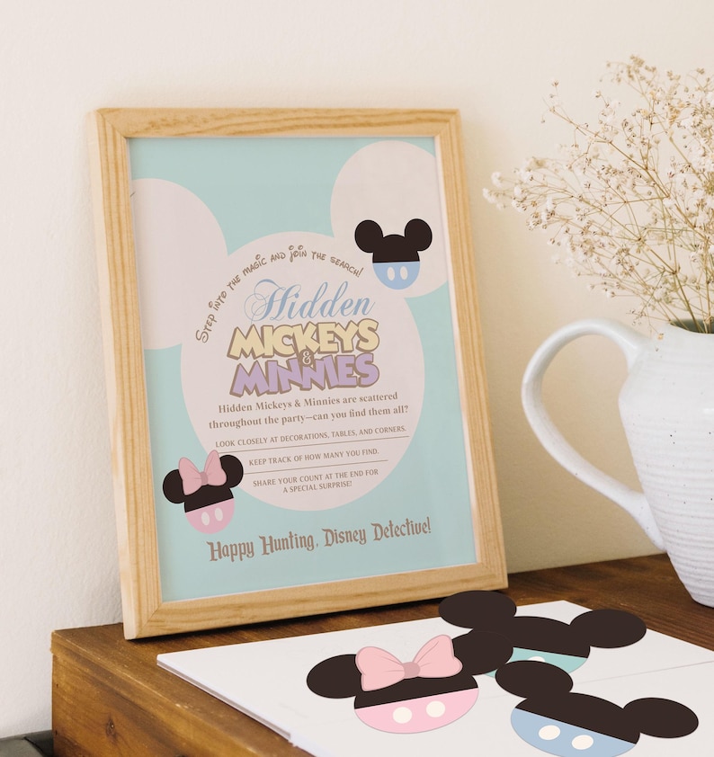 May include: A printable game card with a blue background and a cartoon Mickey Mouse head. The card says "Hidden Mickeys & Minnies" and "Step into the magic and join the search!"  Hidden Mickeys & Minnies are scattered throughout the party - can you find them all? Look closely at decorations, tables, and corners. Keep track of how many you find. Share your count at the end for a special surprise. Happy Hunting, Disney Detective!"