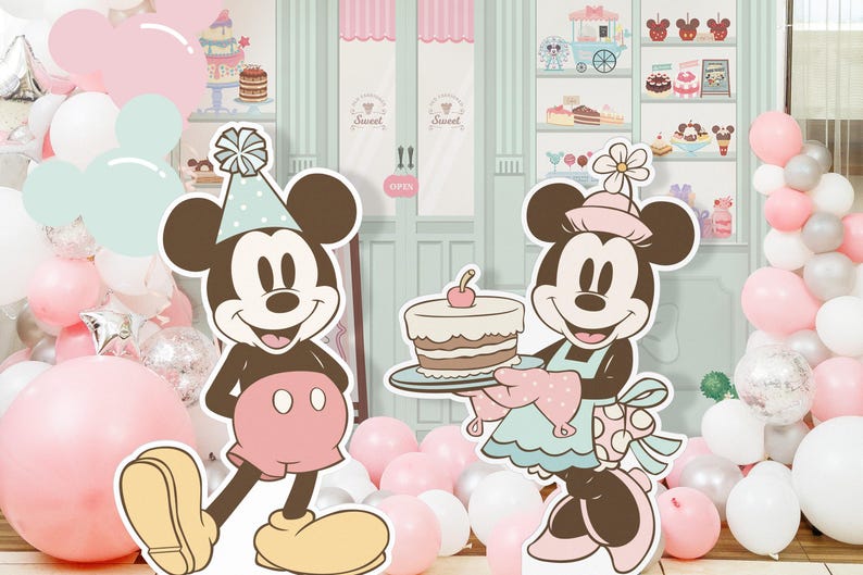 May include: A pink and white balloon arch with a Mickey Mouse and Minnie Mouse cutout. Mickey Mouse is wearing a blue and white hat and Minnie Mouse is wearing a pink and white dress and holding a cake. The background is a light blue and green wall with a candy shop theme.
