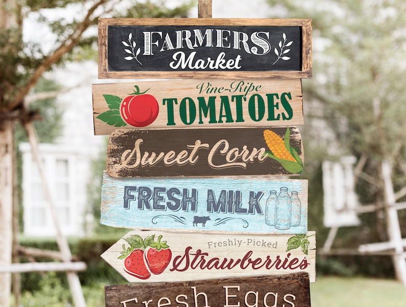 May include: A set of five wooden signs with a farmhouse theme. The signs are painted in various colors and feature illustrations of produce, including tomatoes, corn, milk bottles, and strawberries. The signs read "Farmers Market", "Vine-Ripe Tomatoes", "Sweet Corn", "Fresh Milk", "Freshly-Picked Strawberries", and "Fresh Eggs".