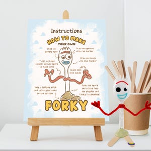 May include: A craft instruction sign titled How to Make Your Own Forky on a wooden easel, featuring a diagram of a spork character with googly eyes, red pipe cleaner arms, and a clay base, alongside a physical Forky figure made of the same materials.