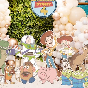 May include: A party scene with Toy Story character cutouts, such as Woody, Buzz Lightyear, and Jessie, set against a backdrop of white, gold, and peach balloons. The decorations are themed for a Toy Story 4 event.