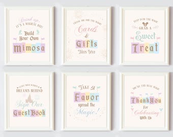 May include: Six printable signs with a pastel color scheme and a whimsical font. The signs feature text such as "Drink Up, It's a Magical Day!" and "Build Your Own Mimosa".