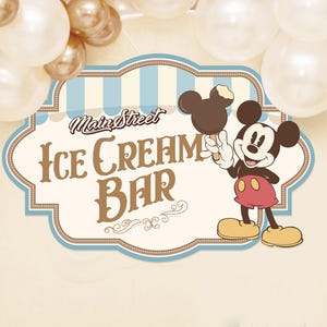 May include: A Main Street Ice Cream Bar sign with Mickey Mouse holding an ice cream bar. The sign is a light brown color with blue and white stripes. Balloons in white and gold are in the background.