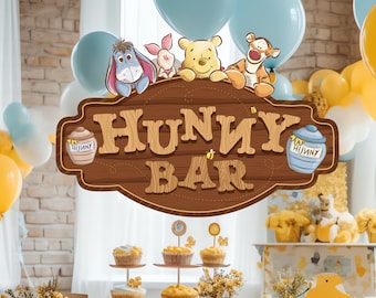 May include: A Winnie the Pooh themed party with a wooden sign that says "Hunny Bar". There are yellow and blue balloons, cupcakes, and a table with a Winnie the Pooh themed centerpiece.
