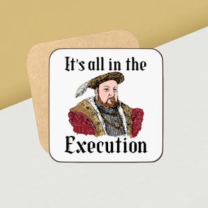 May include: Square coaster with a cartoon illustration of a historical figure, featuring the text "It's all in the Execution." The image is set against a white background, with a tan, rounded-corner square.