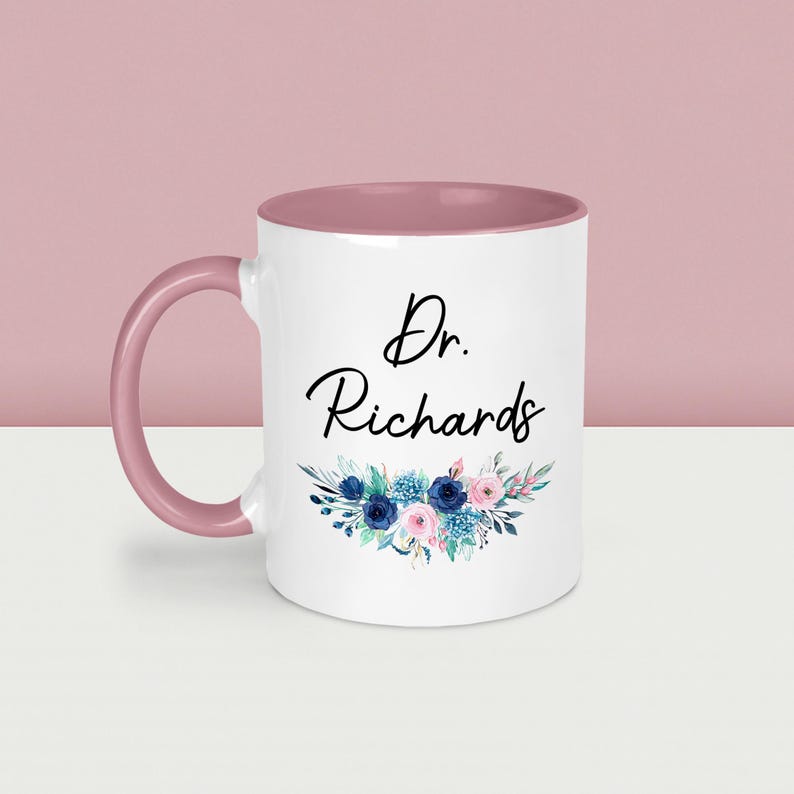 May include: A set of three ceramic mugs with a speckled, matte finish. The mugs are in shades of blue, green, and white. Each mug has a rounded handle and a simple, modern design. The mugs are likely for coffee or tea.