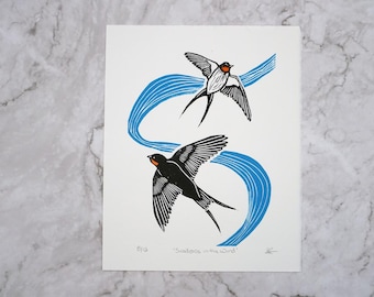 Original swallows flying in the wind block print with orange watercolour detail, hand printed