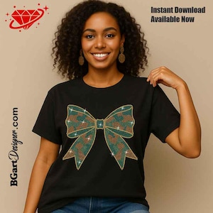 May include: Black t-shirt featuring a large bow design made of green, brown, and gold rhinestones. The text "Instant Download Available Now" is visible in the upper right corner. The website address BGArtDesigner.com is printed on the left side.