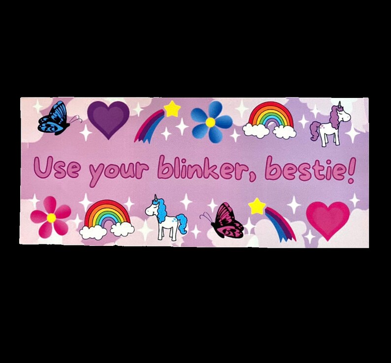 May include: A purple background with a rainbow, stars, hearts, butterflies, and unicorns. The text "Use your blinker, bestie!" is written in pink letters.