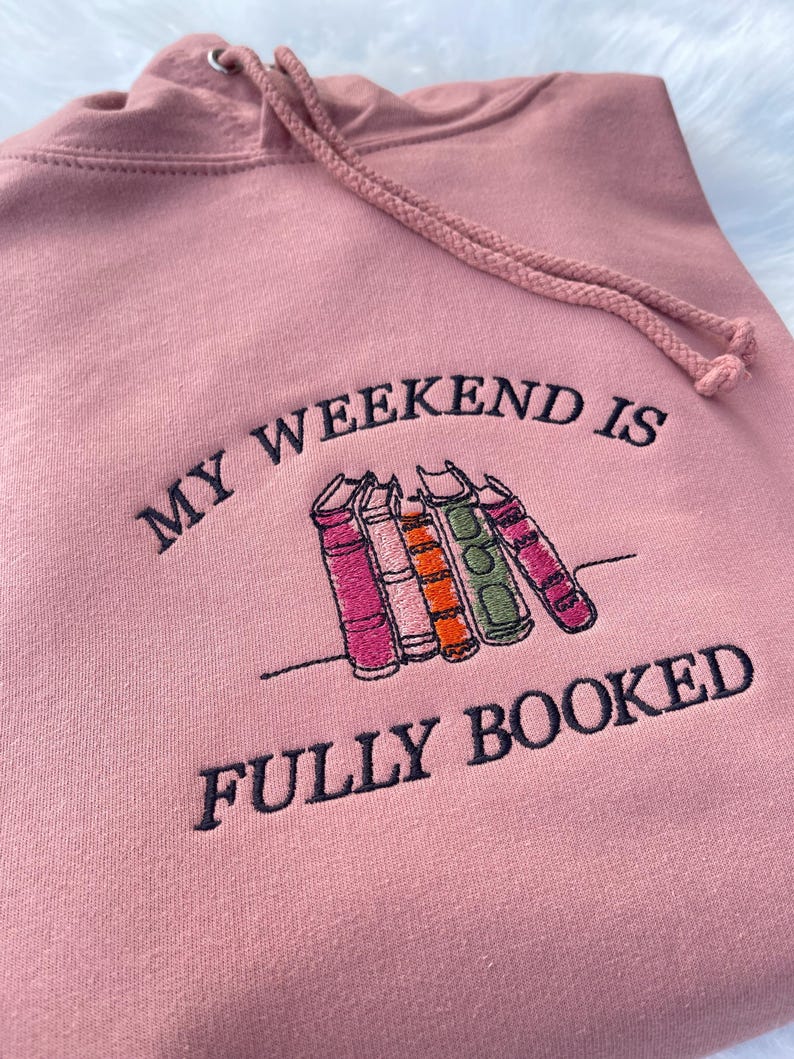 Pink sweatshirt with “My Weekend is Fully Booked” embroidery gift idea