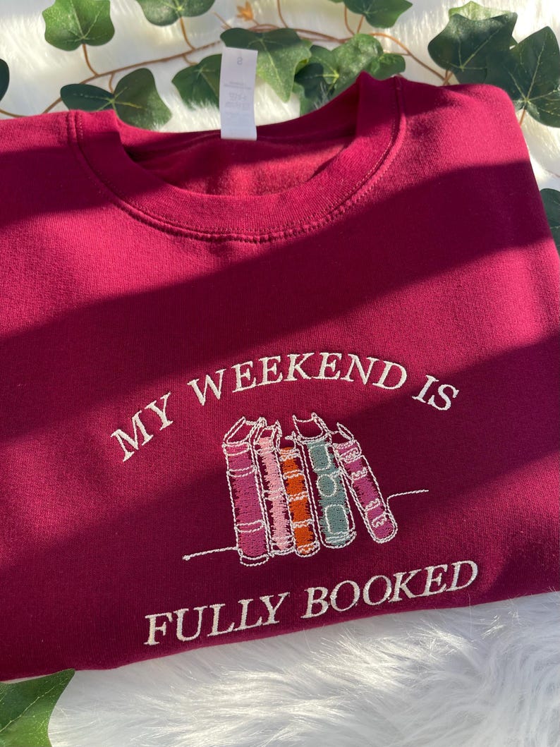 Red sweatshirt “My Weekend is Fully Booked” embroidered for book lovers