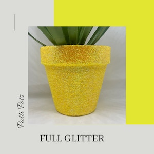 May include: A yellow terracotta pot with a full glitter finish. The pot is empty and ready to be planted with a succulent or other small plant.