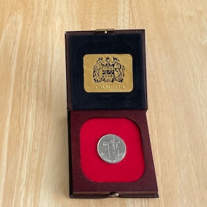 Canada 1984 un dollar Jacques Cartier Canadian Mint en étui pour collection de pièces de monnaie