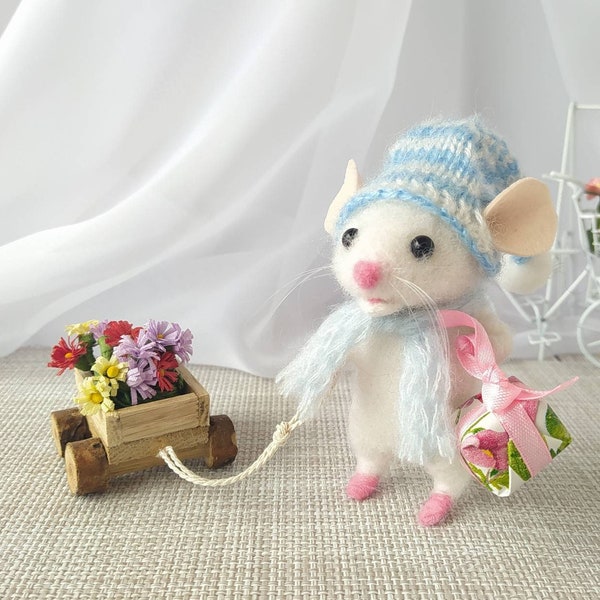 Woolen mouse. Cute gift for a little mouse with flowers.