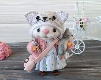 A handmade felt mouse with removable clothing—a miniature animal figurine as a gift