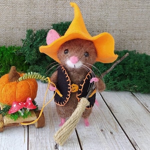 Halloween miniature mouse with pumpkin. Woolly cute halloween mouse