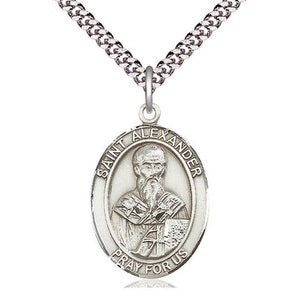 May include: Silver oval pendant with a depiction of Saint Alexander. The pendant has the words "Saint Alexander Pray For Us" inscribed around the edge.