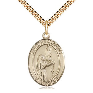 St Bernadette  Pendant on a 24 inch Gold Plate Heavy Curb Chain.