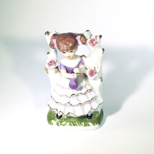 Ceramic girl with pigtails, vintage ceramic figurine, drawstring purple purse, flower arbor, hair bows, ruffles, gold, applied roses