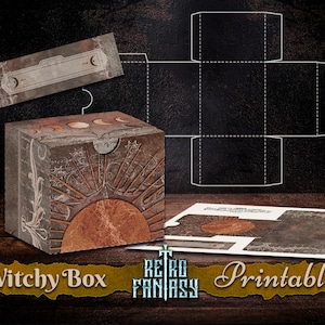 May include: Printable box template with a witchy theme. The box features a sun and moon design with a brown, white, and gold color scheme. The text "Witchy Box" is printed on the front of the box.
