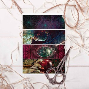 May include: Four rectangular art prints with fantasy-themed illustrations. The prints feature a spiderweb, a face, a mirror, and a hand holding an apple. A pair of decorative scissors rests on the right side.