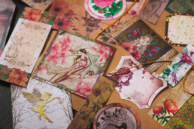 May include: Assortment of vintage-style paper ephemera with floral and fairy designs. The paper is printed with a variety of colors, including pink, green, blue, and brown. The paper is decorated with intricate details, such as flowers, butterflies, and fairies.