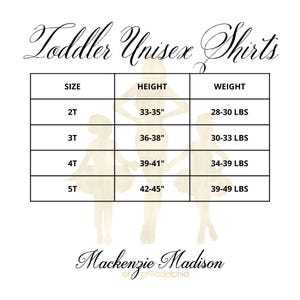 May include: A white chart with the text "Toddler Unisex Shirts" at the top. The chart lists sizes 2T to 5T, with corresponding height in inches and weight in pounds. The brand name "Mackenzie Madison" is at the bottom.