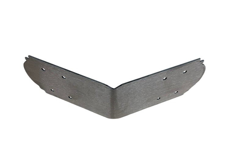 May include: A silver metal corner brace with a textured finish and multiple holes for attaching screws.