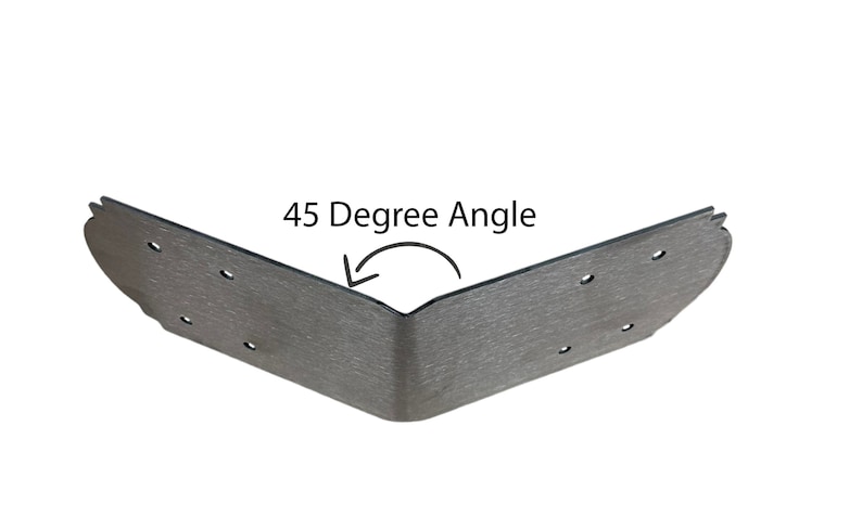May include: A silver metal corner brace with a 45-degree angle. The brace has multiple holes for attaching screws or nails.