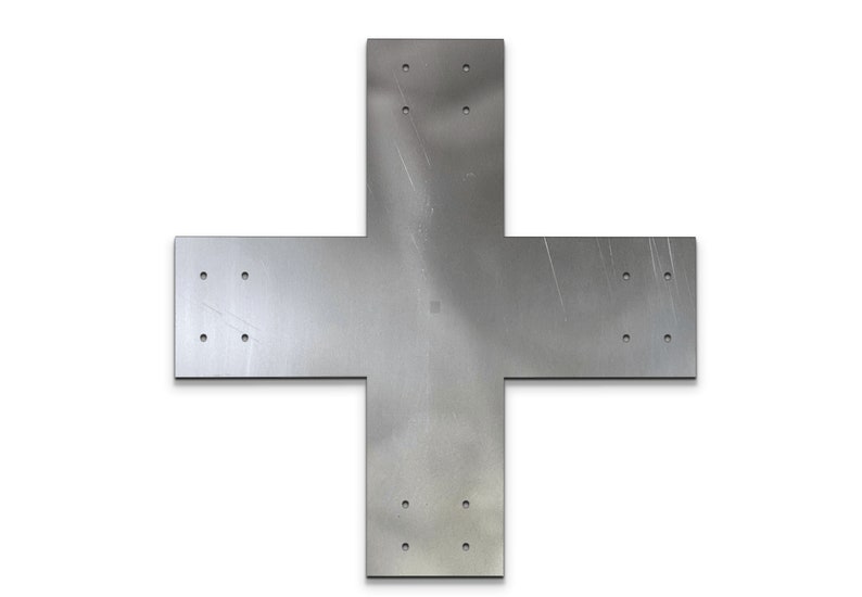 May include: A silver metal cross-shaped plate with multiple holes drilled into it. The plate has a brushed finish and appears to be made of sturdy metal.