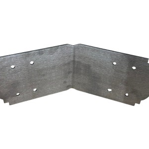 May include: A silver metal corner brace with a decorative edge and four holes for screws.