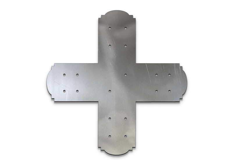 May include: A silver metal corner brace with multiple holes for attaching to wood. The brace has a decorative design on the edges.