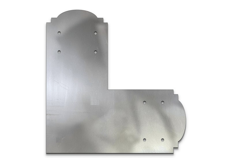 May include: A silver metal corner bracket with decorative edges and multiple holes for mounting.