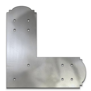 May include: Silver metal corner brace with decorative edges and multiple holes for attaching screws.