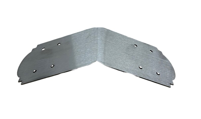 May include: A silver metal corner brace with multiple holes for attaching to a surface. The brace is designed to reinforce a corner joint.