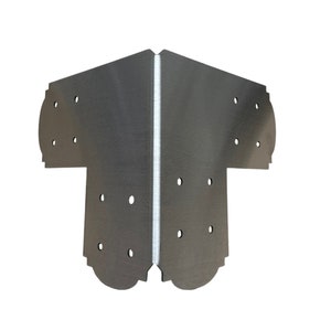 May include: A silver metal corner brace with multiple holes for attaching screws. The brace has a T-shape and is designed to reinforce corners in construction projects.