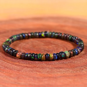 Stretchopalarmband, svart etiopiskt opalarmband, slätt opalarmband, handgjort armband, pärlopalarmband, Welo eldopal,